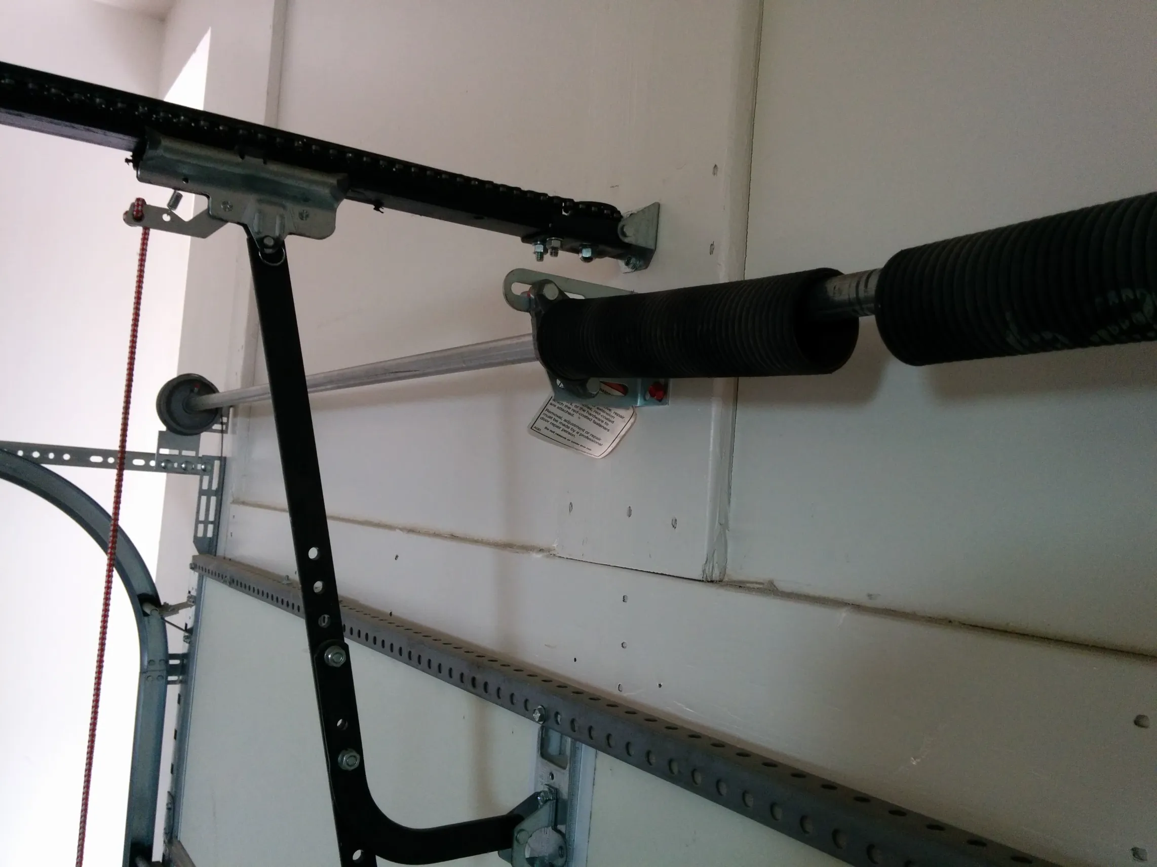 A newer garage door spring that broke