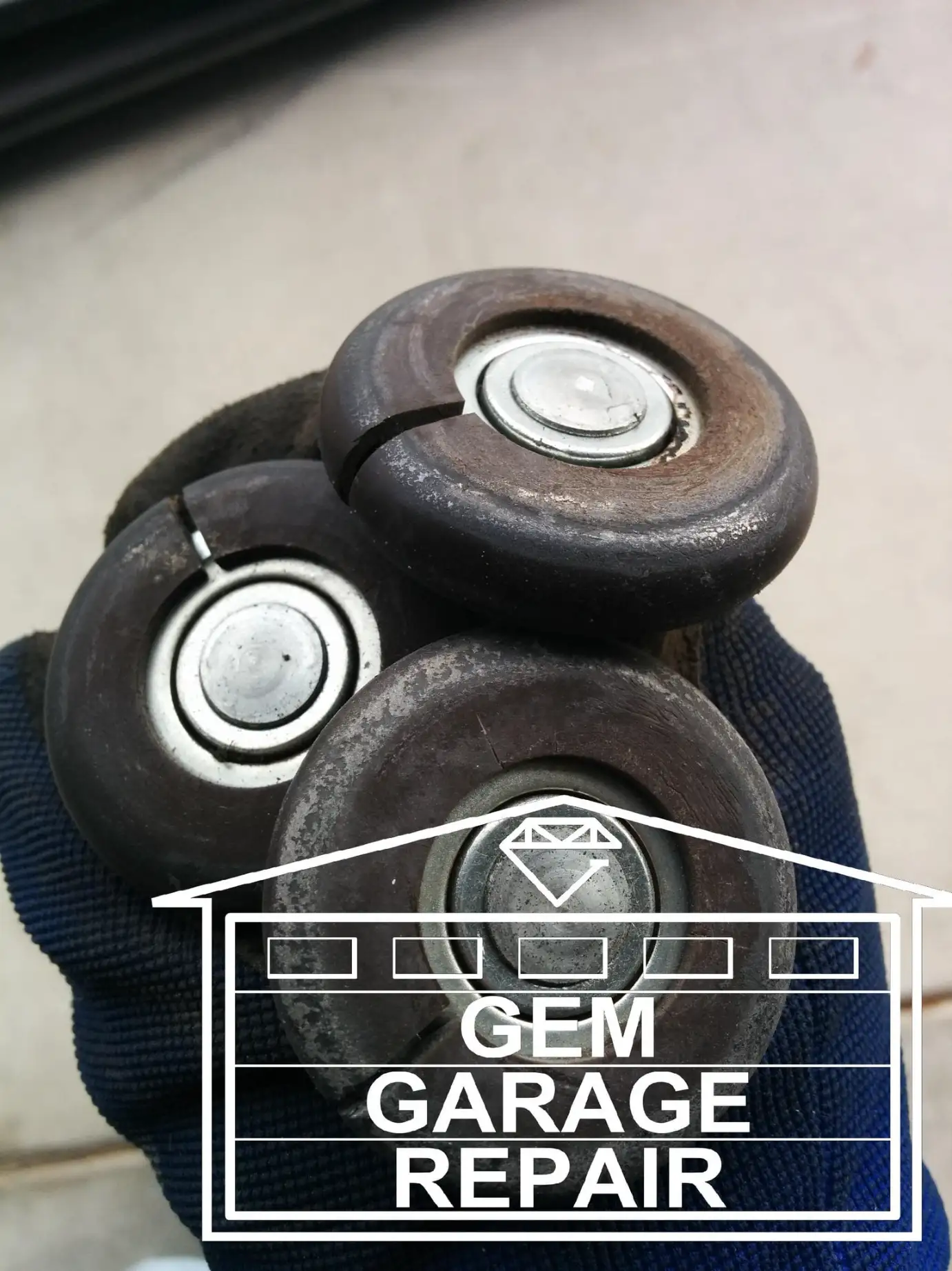 Old cracked, garage door rollers