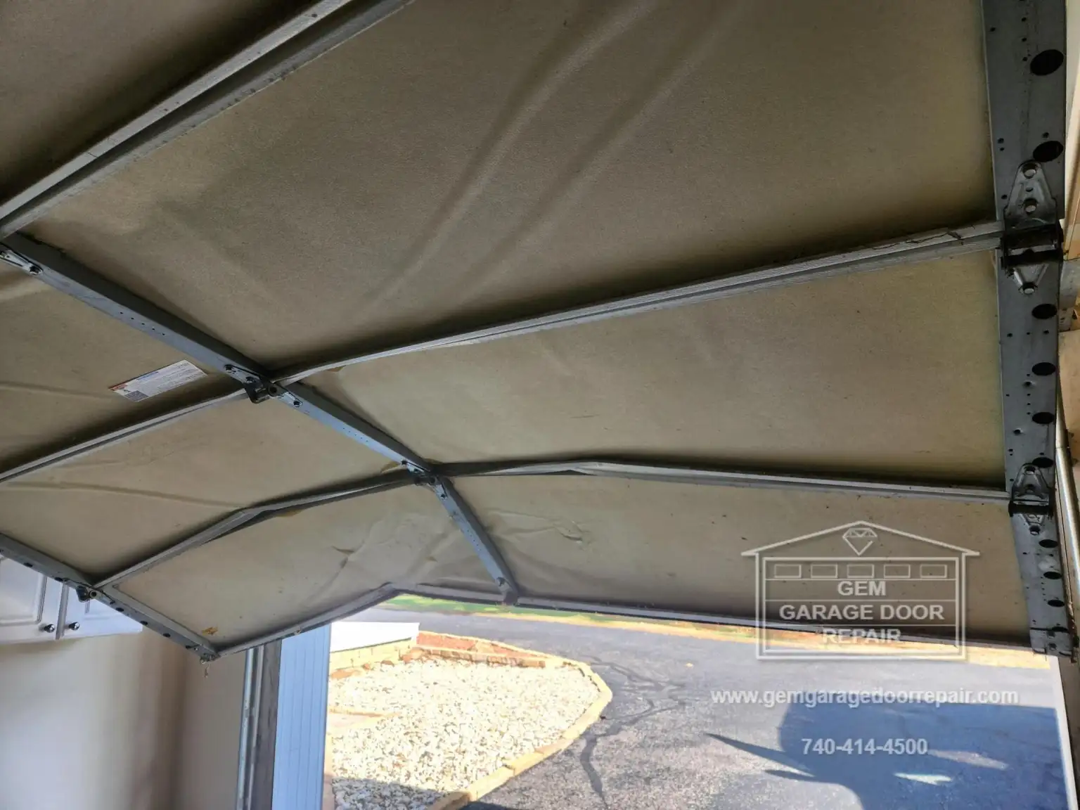 Amazing Repair on Car-Struck Garage Door (Photo 3)