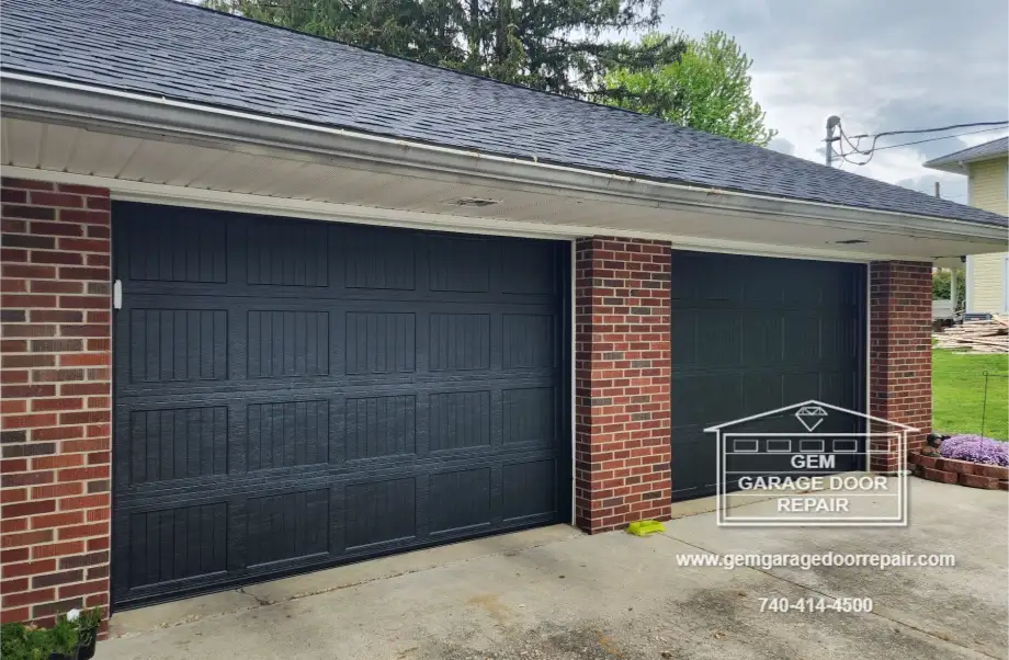 Black Recessed Ribbed Doors on Brick Home (Photo 1)