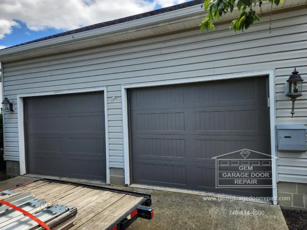 Bold Bronze Carriage House Door Upgrade (Photo 1)