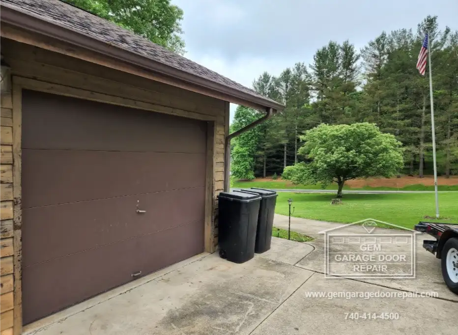 Brown Carriage Style Doors with Hardware (Photo 2)