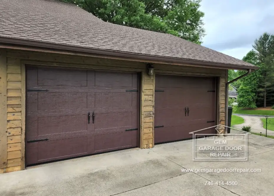 Brown Carriage Style Doors with Hardware (Photo 3)