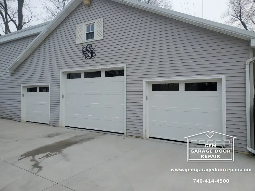 New Doors for Raised Concrete Garage Floor (Photo 1)