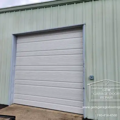 Replacing a Damaged Commercial Bay Door (Photo 1)