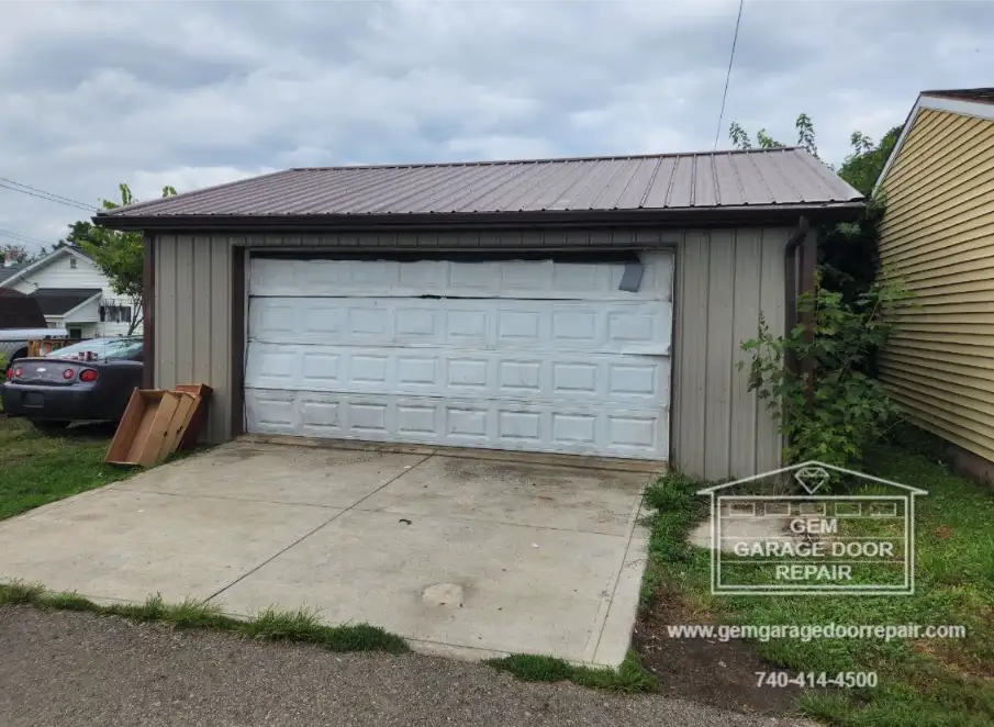 Sad State of a Destroyed Rental Garage Door