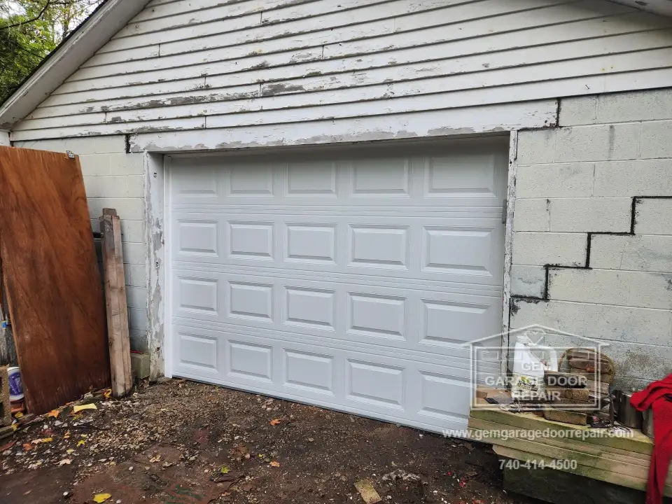 Securing an Open Garage with a New Door (Photo 1)