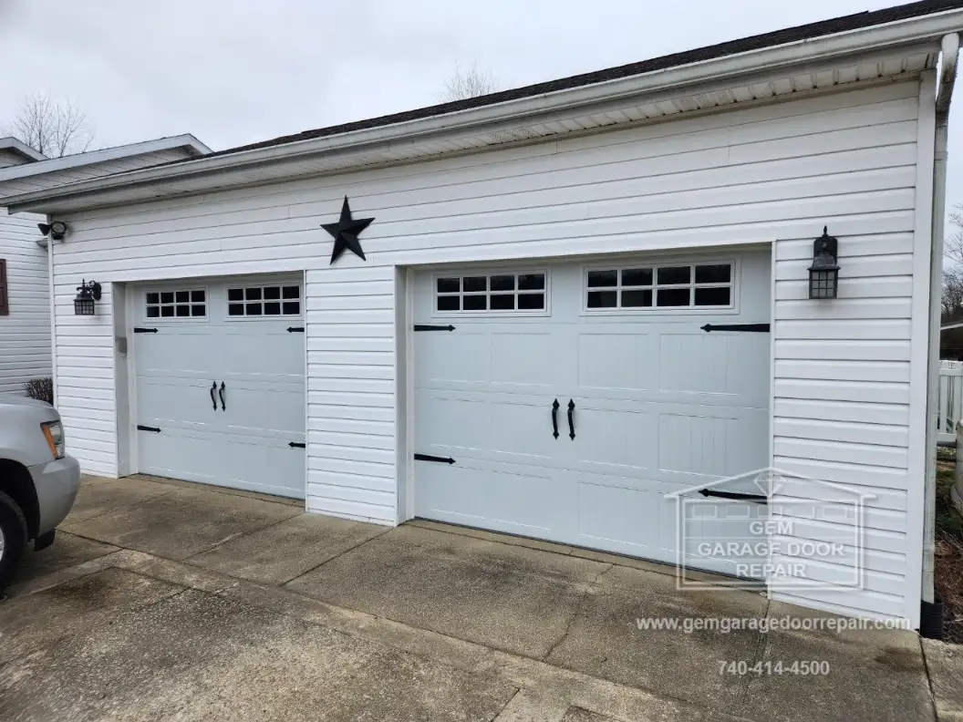 Stamped Carriage House Design with Black Hardware (Photo 1)