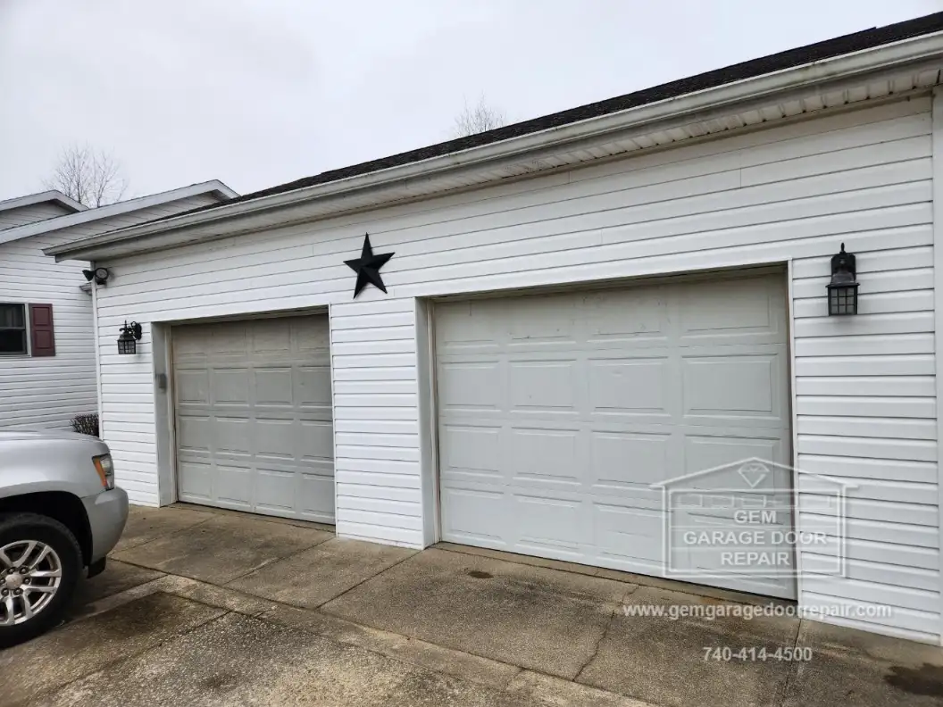 Stamped Carriage House Design with Black Hardware (Photo 2)